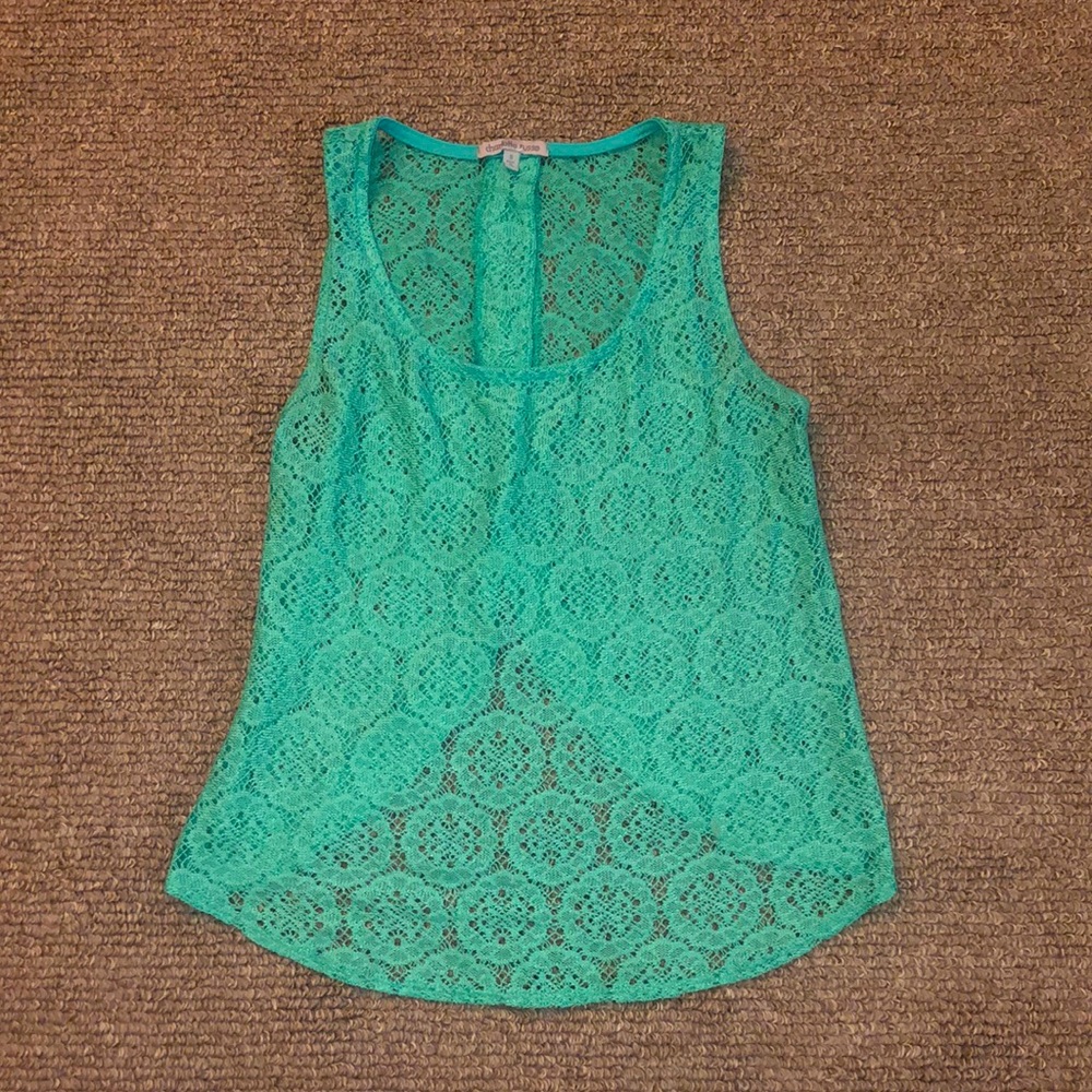 See through take Teal tank top.